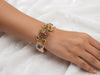 Traditional Temple-Style Multi-Strand Pearl Bracelet with Gemstone Centerpiece