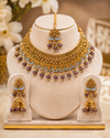 Elevate your traditional look with this exquisitely crafted antique gold-plated jewellery set