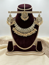 Elegant Kundan Necklace Set with Pearl Clusters and Maang Tikka