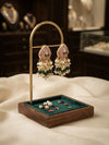 Handcrafted teardrop earrings featuring a vibrant green pink Red center stone accented with delicate ruby-toned floral motifs